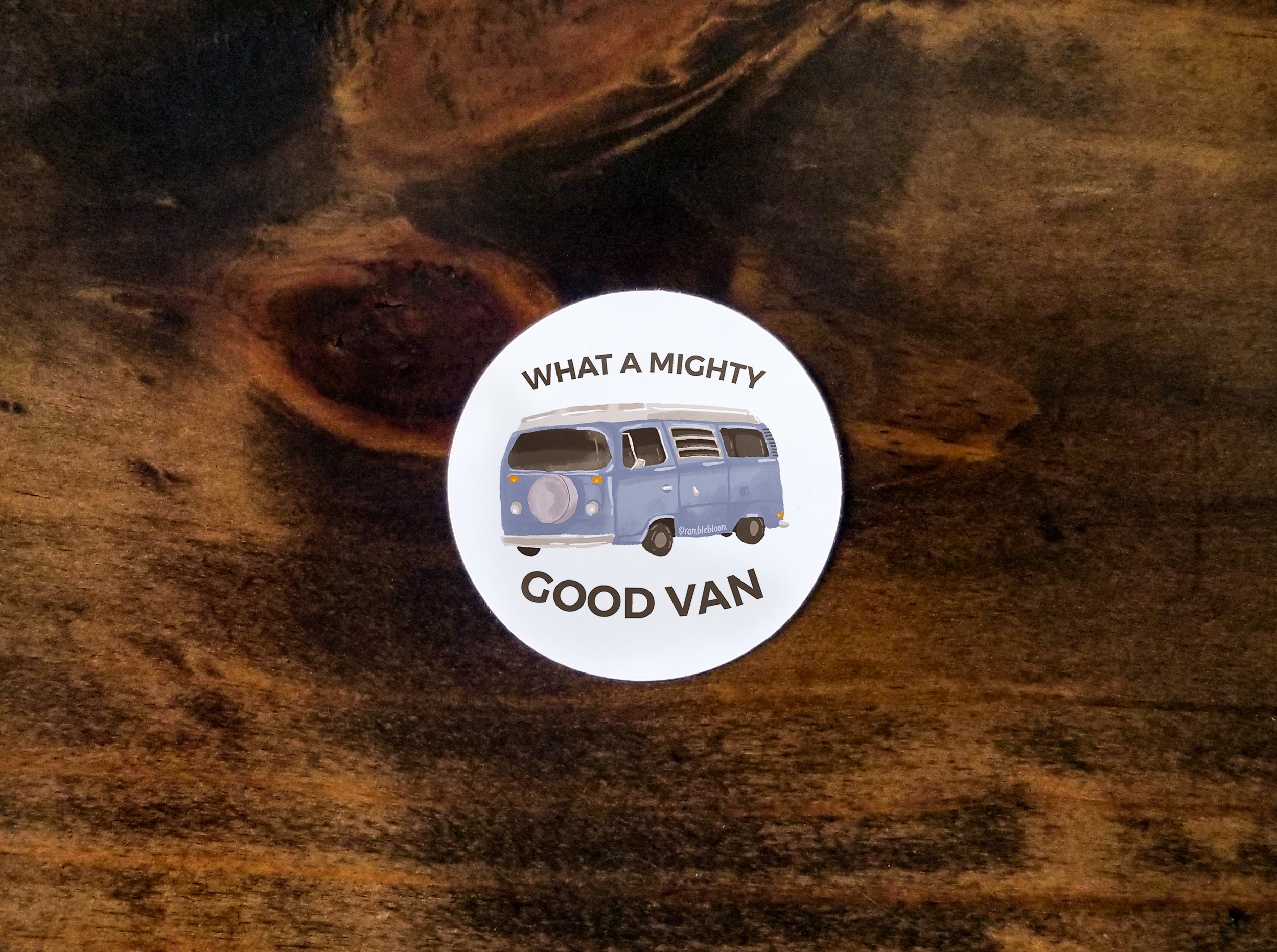 Photo of a circular sticker with the words 'What a Mighty Good Van' around a campervan illustration